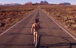 Thumbnail image of naked skinny white dude running down a freeway.